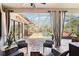 Outdoor living space with comfortable wicker furniture and a view of the pool at 8057 Rio Bella Pl, Bradenton, FL 34201