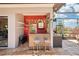 Outdoor wet bar area with seating, shelving, and view of pool at 8057 Rio Bella Pl, Bradenton, FL 34201