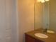 Bathroom vanity featuring neutral color counters and a large mirror at 829 Lantern Way # 829, Clearwater, FL 33765