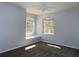 Bright bedroom features two windows with a built-in seat and a ceiling fan at 829 Lantern Way # 829, Clearwater, FL 33765