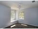 Bedroom featuring two windows with a built-in seat and a ceiling fan at 829 Lantern Way # 829, Clearwater, FL 33765