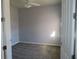 Cozy bedroom with neutral paint, carpet, and ceiling fan at 829 Lantern Way # 829, Clearwater, FL 33765