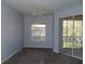 Bedroom with a sliding glass door to a screened in patio, and natural light at 829 Lantern Way # 829, Clearwater, FL 33765