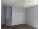 Bedroom featuring a closet with white doors and neutral color walls at 829 Lantern Way # 829, Clearwater, FL 33765