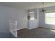Bright living space with modern chandelier lighting and natural light through the large window at 829 Lantern Way # 829, Clearwater, FL 33765