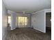 Open living room with ceiling fan, a sliding glass door, and neutral wall color at 829 Lantern Way # 829, Clearwater, FL 33765