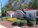 Community entrance sign with lush landscaping at Coachman Reserve at 829 Lantern Way # 829, Clearwater, FL 33765