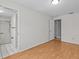 Light-filled bedroom adjacent to the bathroom, featuring wood floors at 862 College Hill Dr, Clearwater, FL 33765