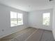 Bright, spacious bedroom with large windows offering plenty of natural light, prepped for final finishes at 8917 Calumet Blvd, Port Charlotte, FL 33981
