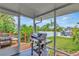 Outdoor kitchen area with built-in grill overlooking a beautiful yard, perfect for backyard barbecues at 922 Sago Palm Way, Apollo Beach, FL 33572