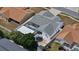 Aerial view of a backyard featuring a screened-in pool, trampoline, patio area, and landscaped yard at 9826 La Vonda St, Riverview, FL 33569