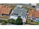 Aerial view of a home with a screened pool, patio, trampoline, and fenced backyard at 9826 La Vonda St, Riverview, FL 33569