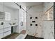 Elegant bathroom featuring a modern shower with stone tile, a sleek vanity, and stylish fixtures at 9826 La Vonda St, Riverview, FL 33569