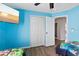 bedroom featuring cartoon wall art, two beds and view of the backyard at 9826 La Vonda St, Riverview, FL 33569
