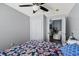 Comfortable bedroom featuring neutral gray walls and access to a closet and living area at 9826 La Vonda St, Riverview, FL 33569