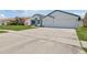 Spacious driveway leading to a home with a large two-car garage at 9826 La Vonda St, Riverview, FL 33569