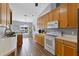 Bright kitchen features stainless appliances, wood cabinetry, and tile flooring at 9826 La Vonda St, Riverview, FL 33569