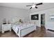 Bedroom featuring wood floors, ceiling fan, and modern design elements at 9826 La Vonda St, Riverview, FL 33569