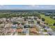Wide aerial view of a suburban neighborhood with mature trees and well-spaced homes at 9826 La Vonda St, Riverview, FL 33569