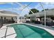 Sparkling blue enclosed pool area with ample space for outdoor seating at 9826 La Vonda St, Riverview, FL 33569