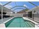 Enclosed pool area with a clear blue pool and covered area at 9826 La Vonda St, Riverview, FL 33569