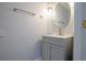 Bathroom with neutral-toned walls, an oval mirror, and a vanity with ample storage at 10411 Cory Lake Dr, Tampa, FL 33647