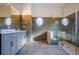 Sleek bathroom with a double vanity, stylish tile work, and a frameless glass shower enclosure for a spa-like feel at 10411 Cory Lake Dr, Tampa, FL 33647