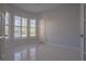 Bedroom features light-colored walls, bright windows, tile flooring, and a standard door at 10411 Cory Lake Dr, Tampa, FL 33647