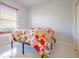 Bright bedroom with a large window and tile floors at 10411 Cory Lake Dr, Tampa, FL 33647