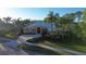 Beautifully landscaped home with a paved driveway and lush greenery, providing curb appeal at 10411 Cory Lake Dr, Tampa, FL 33647