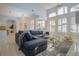 Open-concept living room with stylish furniture, large windows, and seamless flow to other areas of the home at 10411 Cory Lake Dr, Tampa, FL 33647