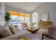 Living room featuring high ceilings, light-colored walls, and a view of the backyard and pool at 10411 Cory Lake Dr, Tampa, FL 33647