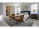 Well-appointed bedroom featuring a tray ceiling, comfortable seating, and contemporary design for a relaxing atmosphere at 10411 Cory Lake Dr, Tampa, FL 33647
