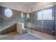 Contemporary shower featuring frameless glass, unique design, and a rain shower head for a spa-like experience at 10411 Cory Lake Dr, Tampa, FL 33647