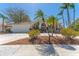 Attractive single-story home featuring a tile roof, well-manicured landscaping, and an attached two-car garage at 10408 Double Bayou Way, Tampa, FL 33615