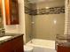 Bathroom boasting updated fixtures and a beautifully tiled shower and tub at 105 S Obrien St # 216, Tampa, FL 33609