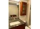 Bathroom featuring updated fixtures and a decorative mirror at 105 S Obrien St # 216, Tampa, FL 33609