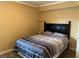 Cozy bedroom featuring a bed with striped comforter and neutral paint at 105 S Obrien St # 216, Tampa, FL 33609
