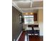 View of dining area with coffered ceilings, wood floors, bar, and window at 105 S Obrien St # 216, Tampa, FL 33609