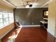 View of dining area with coffered ceilings, wood floors, bar, and window at 105 S Obrien St # 216, Tampa, FL 33609