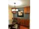 Dining area with a wood-trimmed table, upholstered chairs, and granite-topped buffet at 105 S Obrien St # 216, Tampa, FL 33609