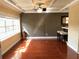 View of dining area with coffered ceilings, wood floors, bar, and window at 105 S Obrien St # 216, Tampa, FL 33609