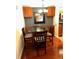 Dining area featuring a round table, cushioned chairs, and overhead lighting and cabinets at 105 S Obrien St # 216, Tampa, FL 33609