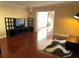 View of living room with wood floors, entertainment center, and natural light at 105 S Obrien St # 216, Tampa, FL 33609
