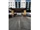 Covered parking area featuring yellow stucco and stone supports for weather protection at 105 S Obrien St # 216, Tampa, FL 33609