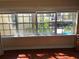 View from window overlooking pool area with mature trees and landscaping at 105 S Obrien St # 216, Tampa, FL 33609