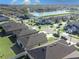 Neighborhood aerial view showcasing lush landscapes and a scenic lake, with well-maintained single Gathering homes at 1107 Brenton Leaf Dr, Ruskin, FL 33570