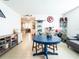 Open bonus room with tiled floors, featuring a blue table set and decor that adds a playful touch at 1107 Brenton Leaf Dr, Ruskin, FL 33570