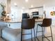 Kitchen with granite countertops, modern appliances, and bar seating area at 1107 Brenton Leaf Dr, Ruskin, FL 33570