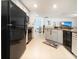 The Kitchen includes modern appliances and tile floors, perfect for cooking and gathering at 1107 Brenton Leaf Dr, Ruskin, FL 33570